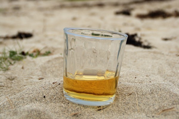 image of a whisky on the beach