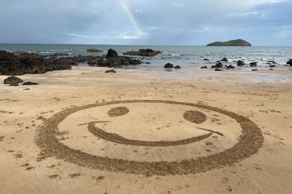 A smiley face in the sand