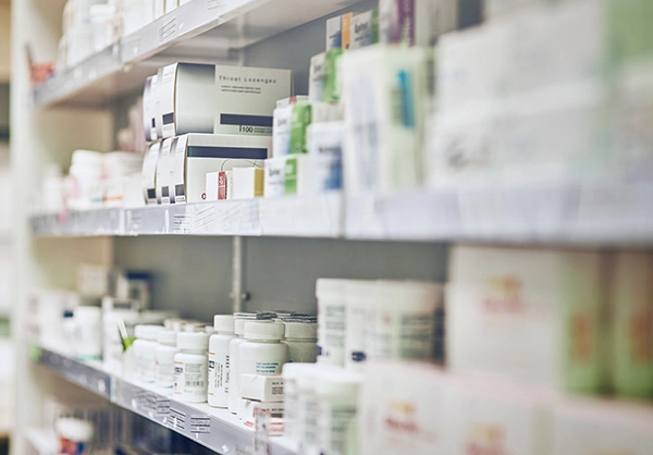 prescriptions on a pharmacy shelf